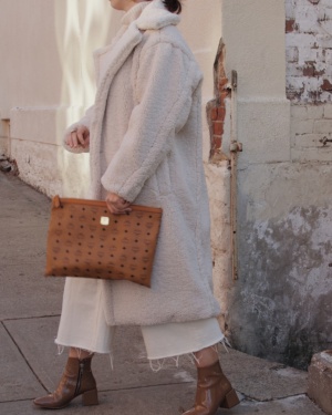 Wearing Cream Faux Fur Coat with Brown Clutch and Booties