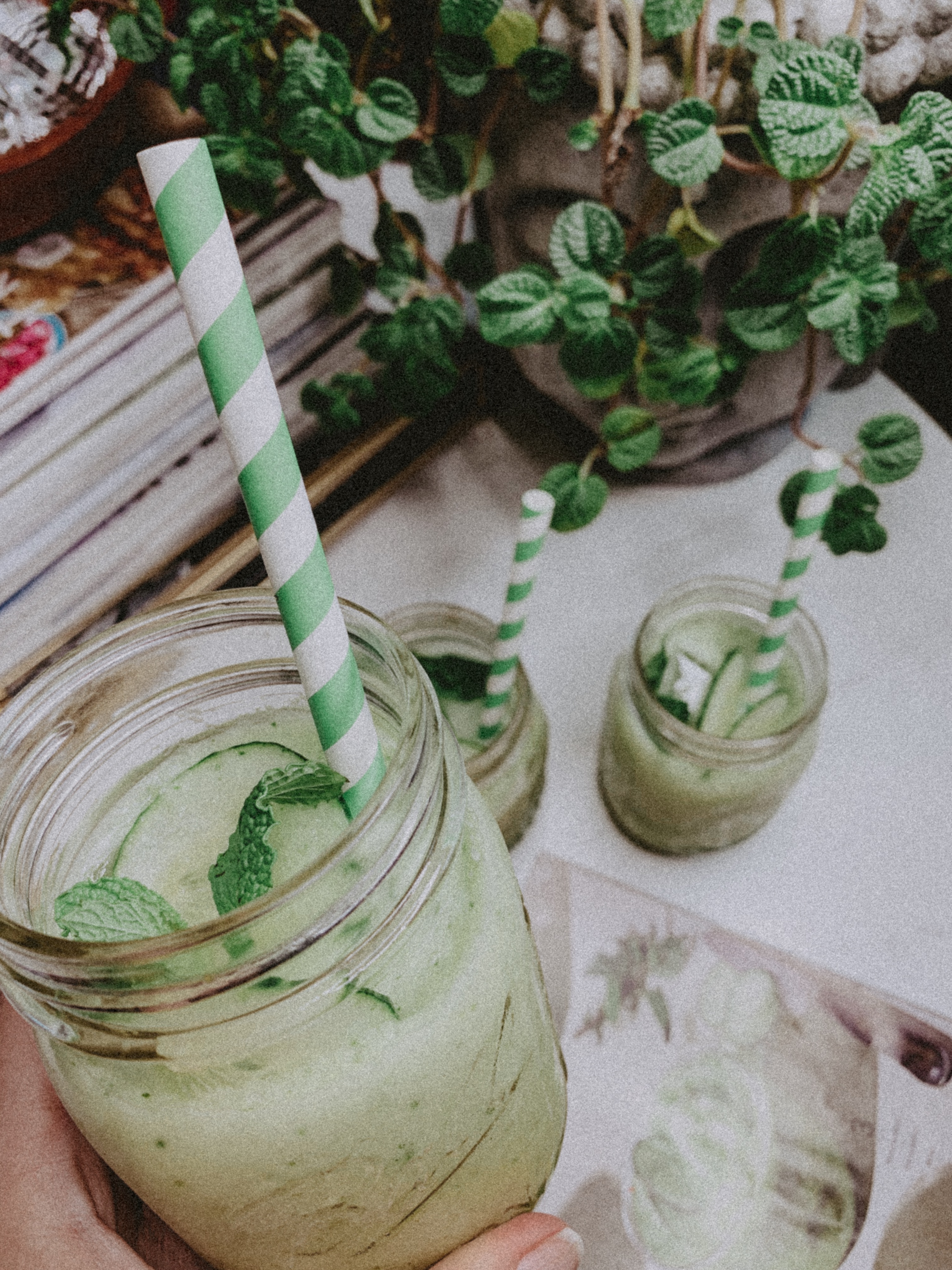 Close Up - Two Summer Mocktails That Will Leave You Feeling Refreshed- Honeydew Cucumber Mint Mocktail - Simply by Simone #cheers #cocktails #mocktails #drinks #summer #refreshed #blogger #lifestyle #lifestyleblog #lifestyleblogger #cocktail #mocktail #honeydew #paperstraws #decor #flowers #cocktailcourier