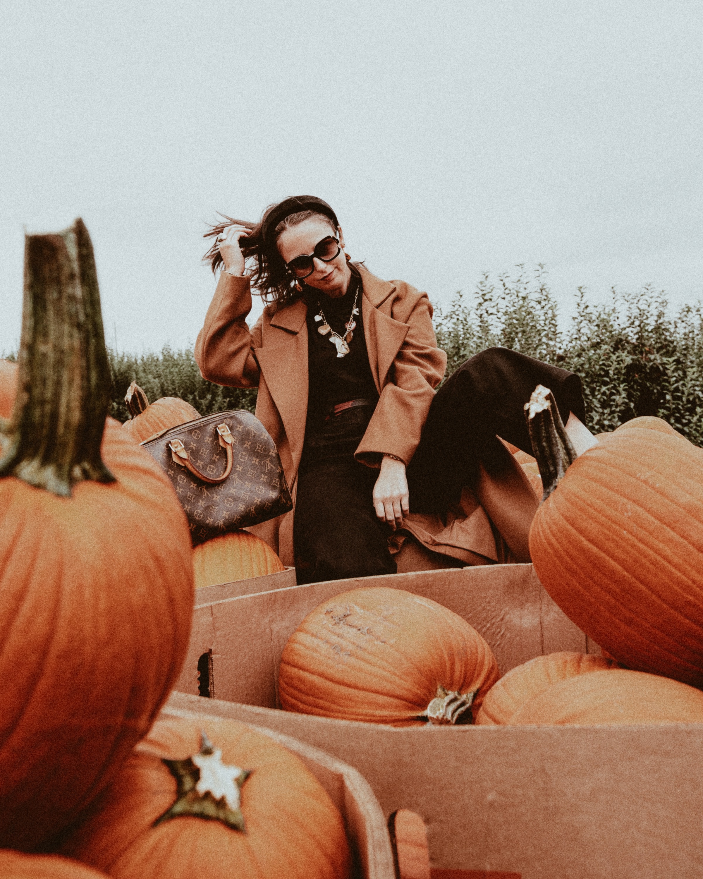 Girls Trip Apple Picking and Pumpkin Picking Outside of NYC - Simply by Simone - Simone Piliero - Photographer Riley McCarthy – Barton Orchard – Dutchess Coutny - Fall Fashion - Fall Outfit - Fall Style - Apples - Tree - Louis Vuitton #fashion - Camel Coat - Black Jeans - Vans Sneakers - fashion poses - #outfit #style #fallfashion #falloutfit #westchestercounty #dutchesscounty #nyc #northofnyc #suburbs #pumpkinpicking #bloggerstyle #applepicking #pumkinpatch #poses