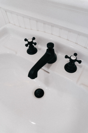 Simply by Simone - Simone Piliero - My Black and White Bathroom Renovation - Finished Photos - Sink with vintage matte black fixtures #bathroom #home #renovation #bathroomrenovation #diyhome #bathroomtiles #bathroomdecor #bathroomideas #bathroomrenovationideas