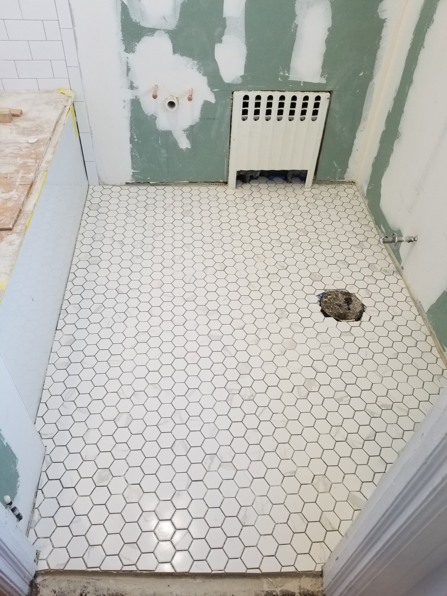 Simply by Simone - Simone Piliero - My Black and White Bathroom Renovation - Hexigon Marble Tiles Installed #bathroom #home #renovation #bathroomrenovation #diyhome #bathroomtiles #bathroomdecor #bathroomideas #bathroomrenovationideas