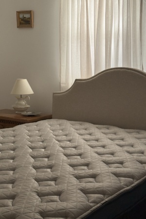 Close-up overhead angle of the Helix Twilight mattress showing the quilted mattress top, supportive hybrid design, and neutral bedroom styling for an honest Helix mattress review.
